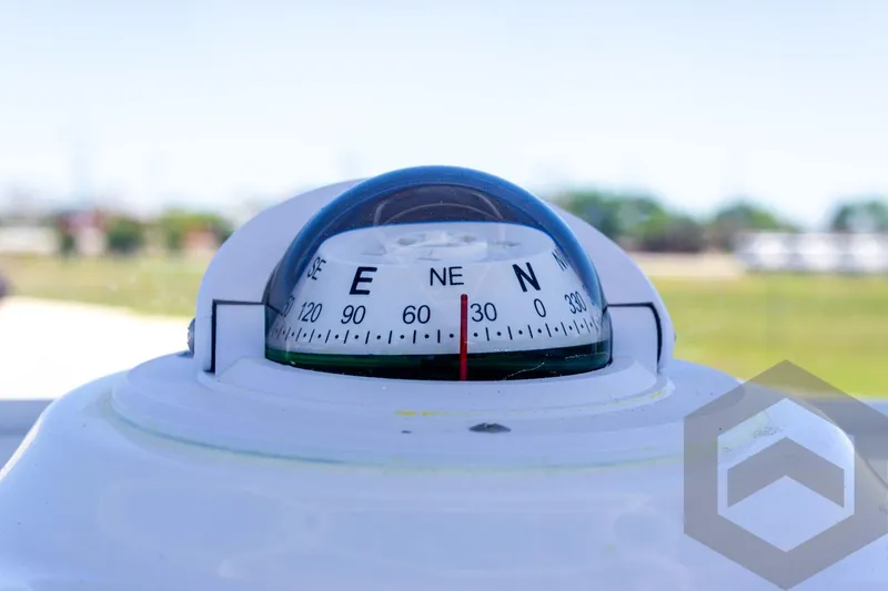 Slide: The Image of Compass on 2025 Tidewater 2110 Bay Max boat, showing northeast direction. - 40