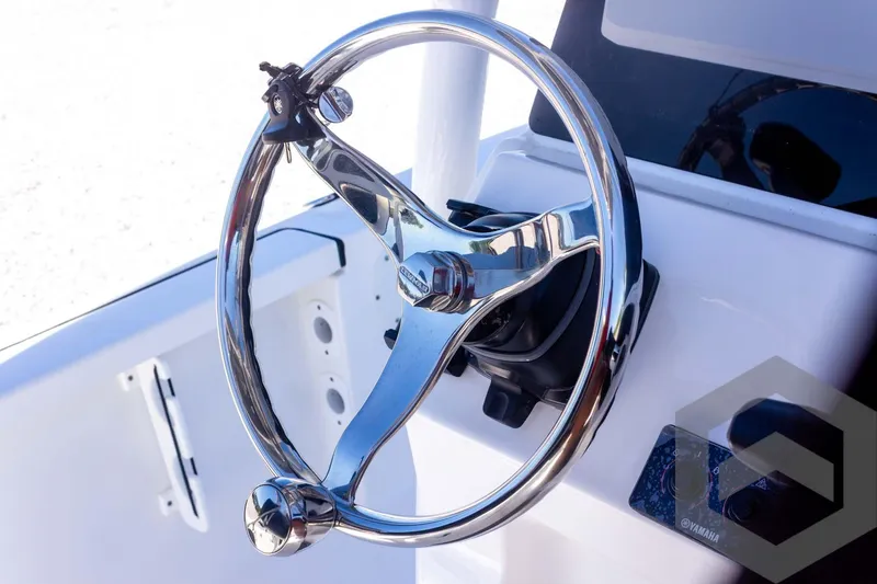 Slide: The Image of Steering wheel of 2025 Tidewater 2110 Bay Max boat, featuring sleek chrome design. - 41