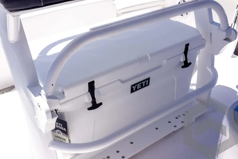 Slide: The Image of YETI cooler on 2025 Tidewater 2110 Bay Max boat, secured with white rail. - 44