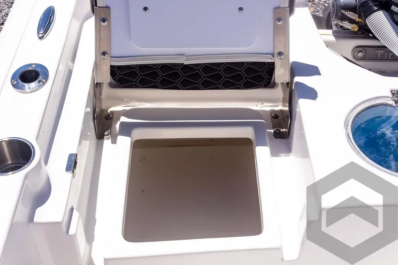 Slide: The Image of 2025 Tidewater 2110 Bay Max boat storage compartment and seating detail. - 46
