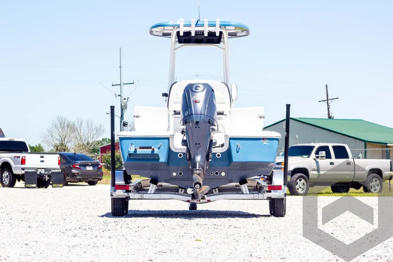 Slide: The Image of 2025 Tidewater 2110 Bay Max boat on trailer, rear view, parked outdoors. - 6