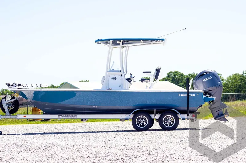 Slide: The Image of 2025 Tidewater 2110 Bay Max boat on trailer, side view, outdoors. - 8