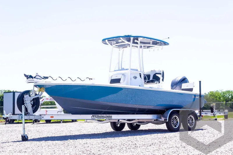Slide: The Image of 2025 Tidewater 2110 Bay Max boat on trailer, blue hull, outdoor setting. - 9