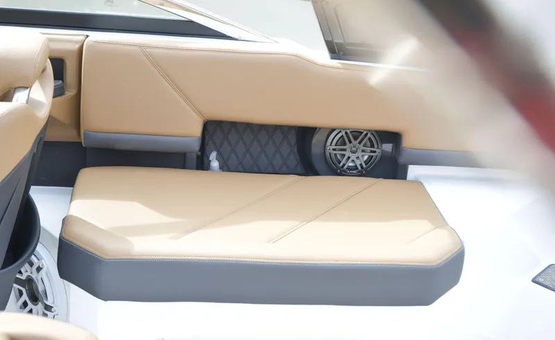 Slide: The Image of 2022 Cobalt R6 boat interior with tan seating and speaker system. - 13