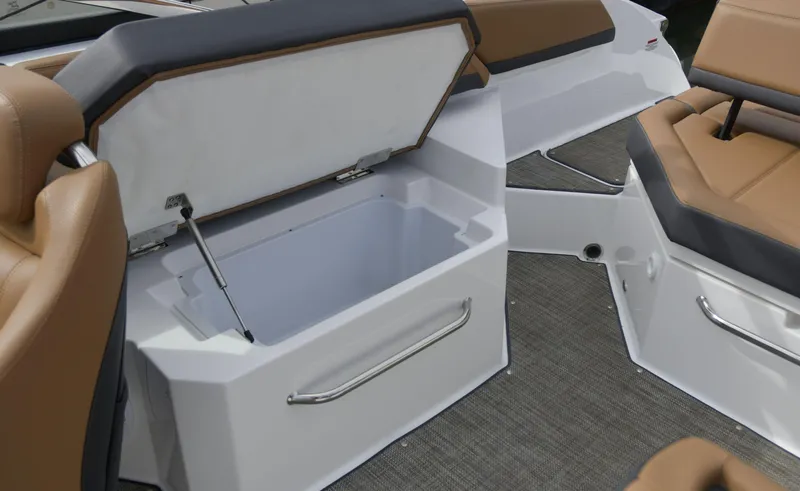 Slide: The Image of 2022 Cobalt R6 boat interior with open storage compartment and cushioned seating. - 14