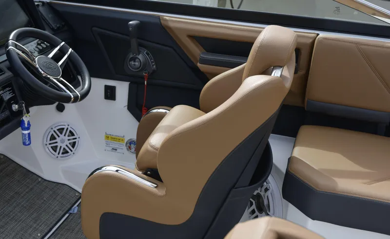 Slide: The Image of Interior of 2022 Cobalt R6 boat with tan leather seats and steering wheel. - 16