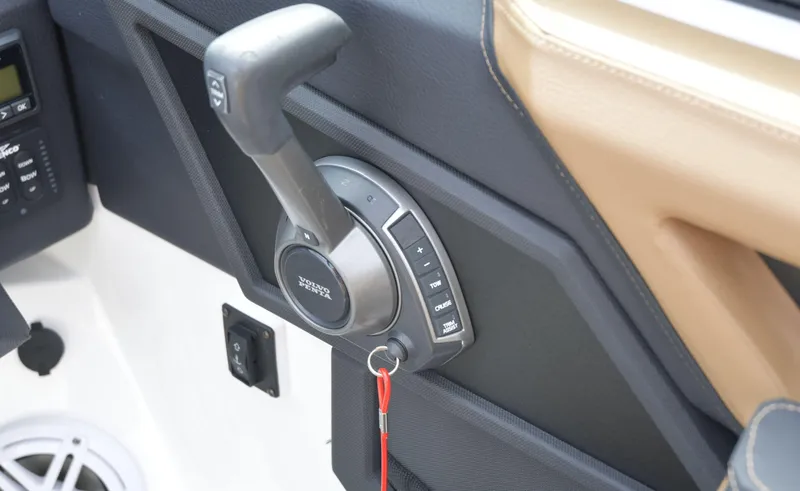 Slide: The Image of Throttle control panel of a 2022 Cobalt R6 boat, featuring ergonomic design and controls. - 18