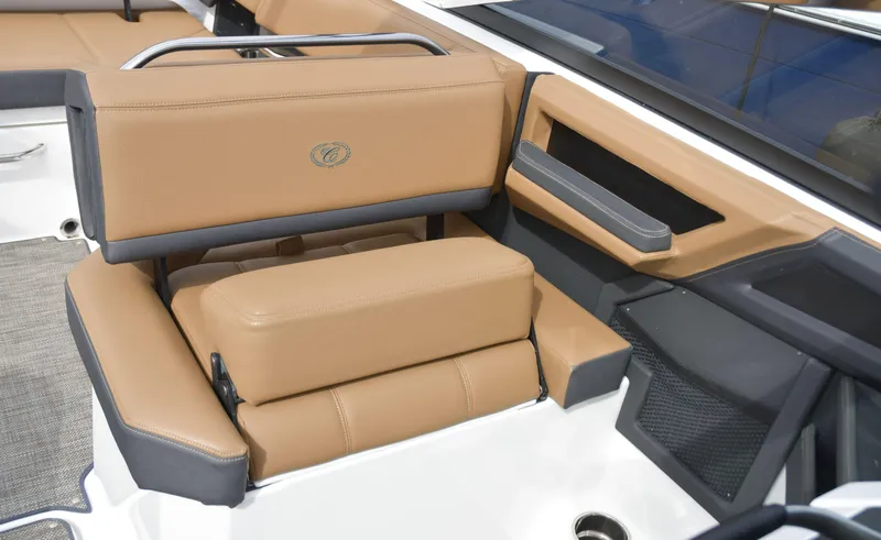 Slide: The Image of 2022 Cobalt R6 boat interior with tan and gray seating, featuring modern design and comfort. - 21
