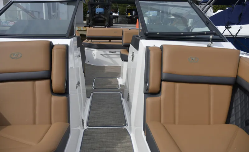 Slide: The Image of 2022 Cobalt R6 boat interior with tan leather seats and sleek design. - 23