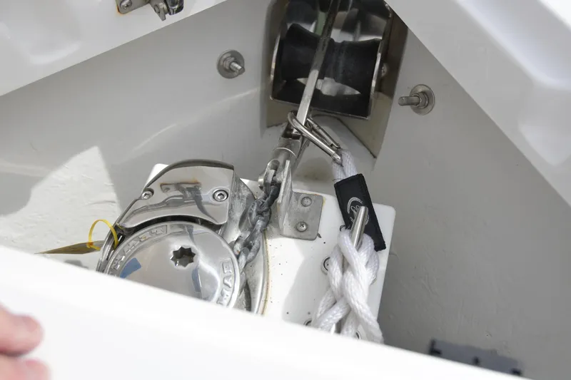 Slide: The Image of 2022 Cobalt R6 boat anchor compartment with winch and rope. - 25
