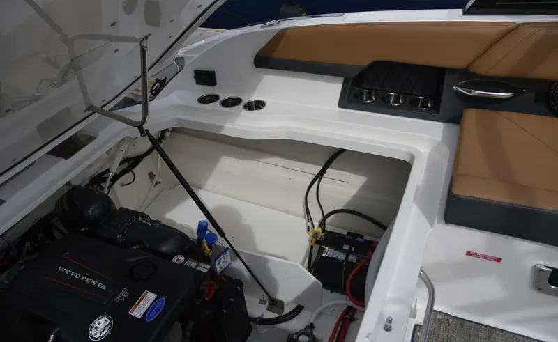 Slide: The Image of 2022 Cobalt R6 boat engine compartment with seating and storage area. - 27
