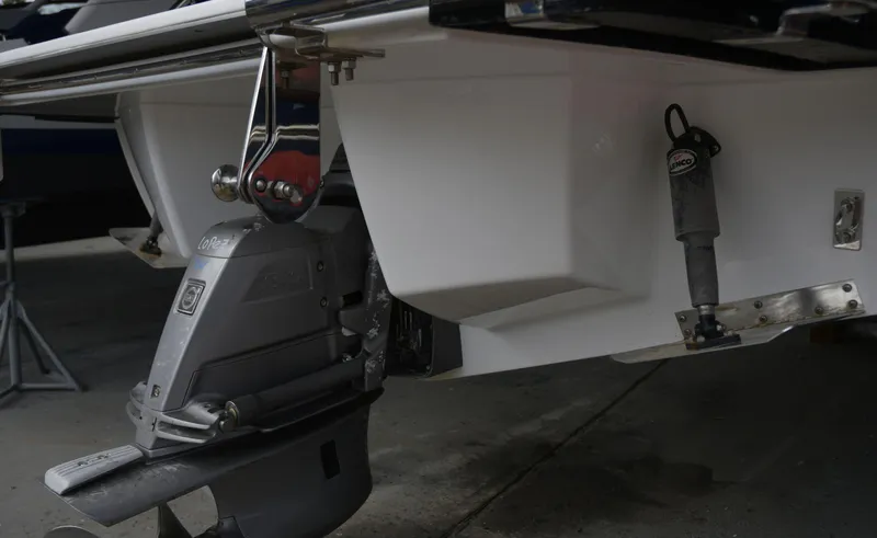 Slide: The Image of Rear view of a 2022 Cobalt R6 boat's outboard motor and hull. - 28