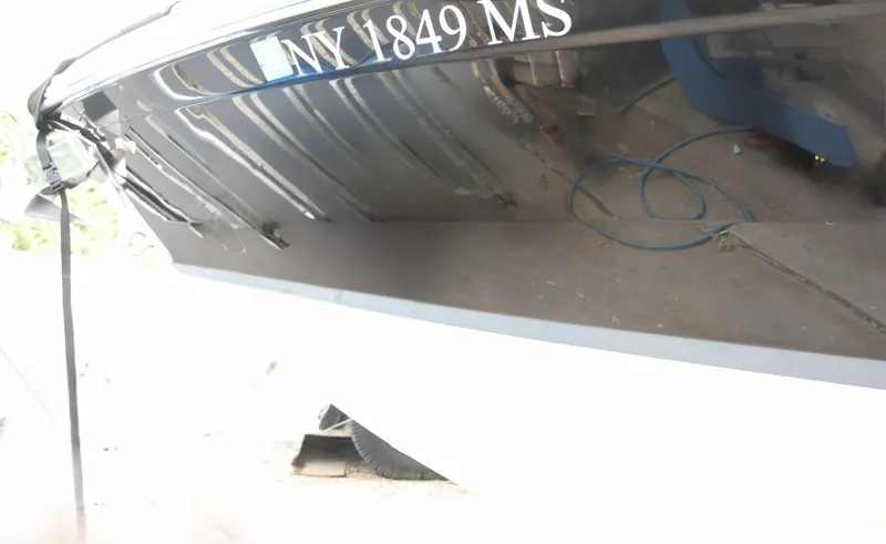 Slide: The Image of 2022 Cobalt R6 boat with registration NY 1849 MS, partially visible hull. - 33