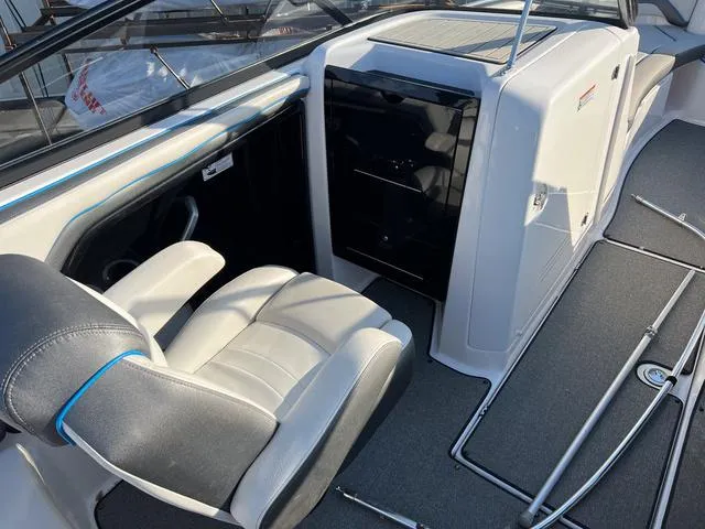 Slide: The Image of 2020 Yamaha Boats AR240 interior with seating and storage area. - 10