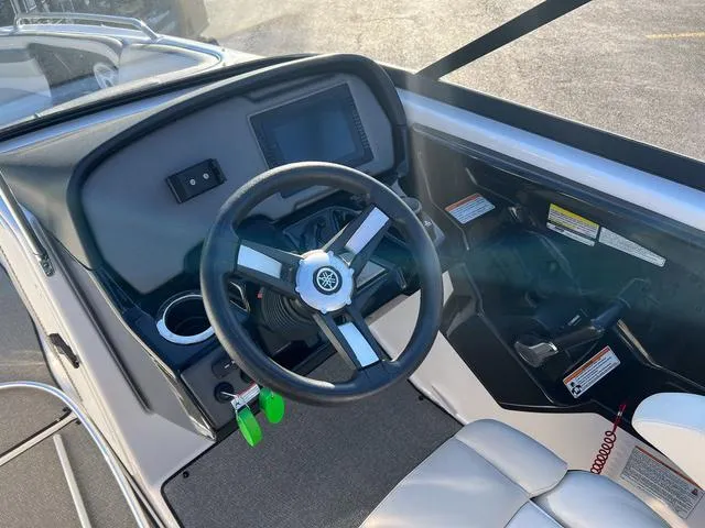 Slide: The Image of 2020 Yamaha Boats AR240 steering console with modern controls and display. - 14