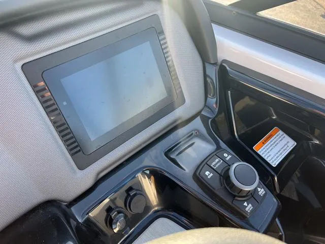 Slide: The Image of Control panel of a 2020 Yamaha AR240 boat with touchscreen display and navigation controls. - 15