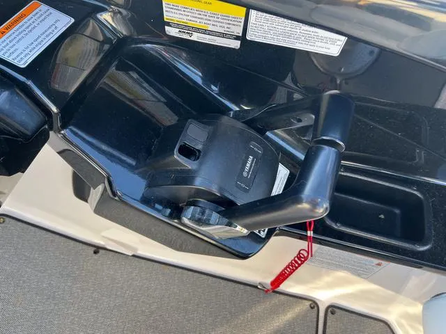 Slide: The Image of Yamaha AR240 2020 boat throttle control with safety lanyard and warning labels. - 16