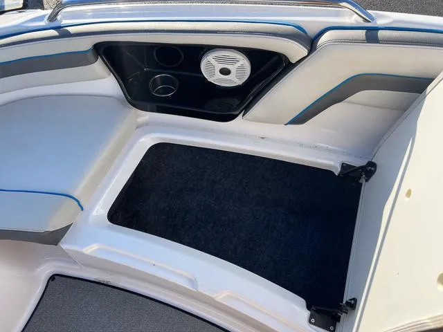 Slide: The Image of 2020 Yamaha AR240 boat interior with seating, speaker, and storage compartment. - 21