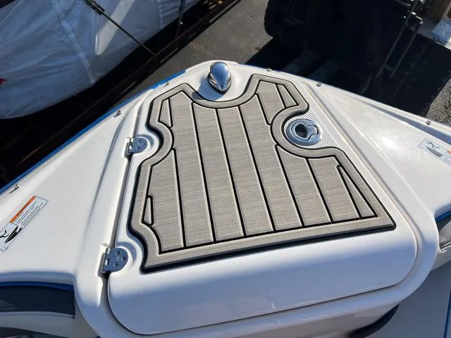 Slide: The Image of 2020 Yamaha Boats AR240 bow with sleek deck design and stainless steel fixtures. - 23