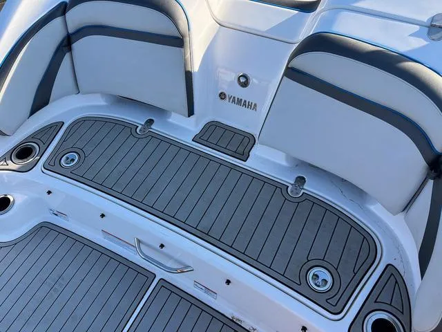 Slide: The Image of 2020 Yamaha AR240 boat interior with sleek seating and non-slip flooring. - 6