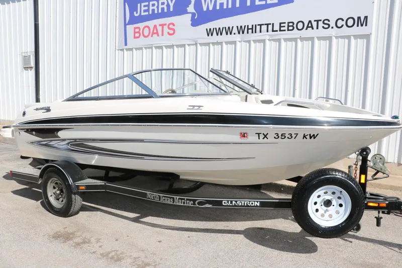Slide: The Image of 2009 Glastron GT185 boat on trailer at Jerry Whittle Boats dealership. - 10