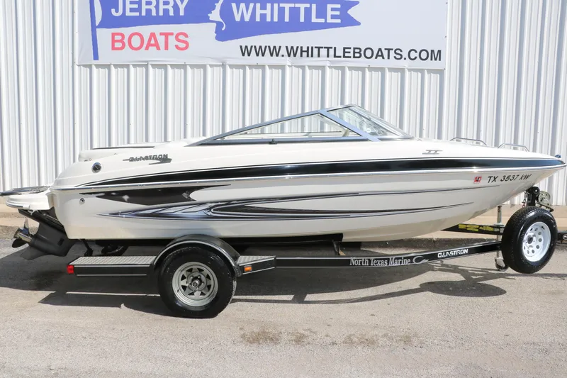 Slide: The Image of 2009 Glastron GT185 boat on trailer at Jerry Whittle Boats dealership. - 11