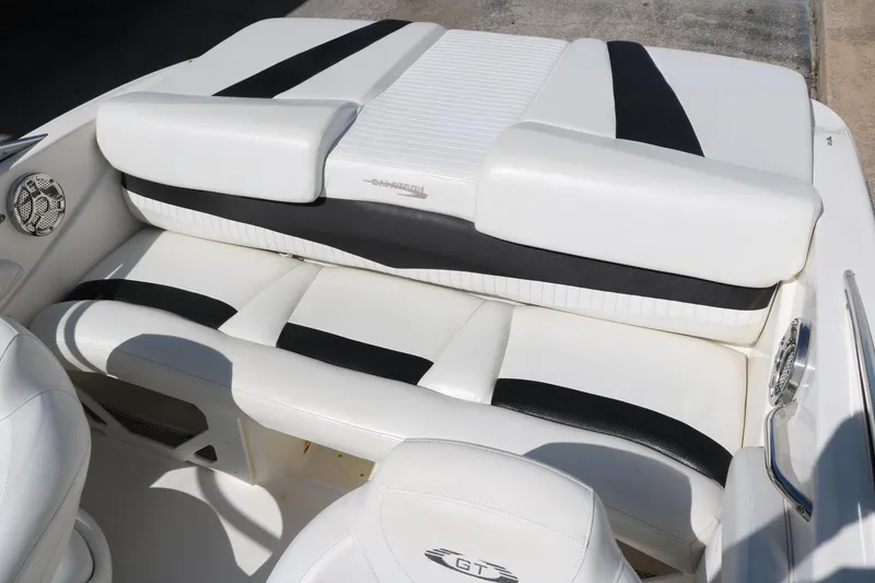 Slide: The Image of 2009 Glastron GT185 boat interior with white and black seating. - 21