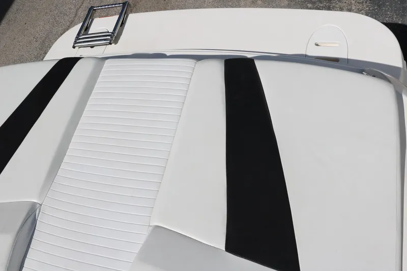 Slide: The Image of 2009 Glastron GT185 boat with white and black seating detail. - 27
