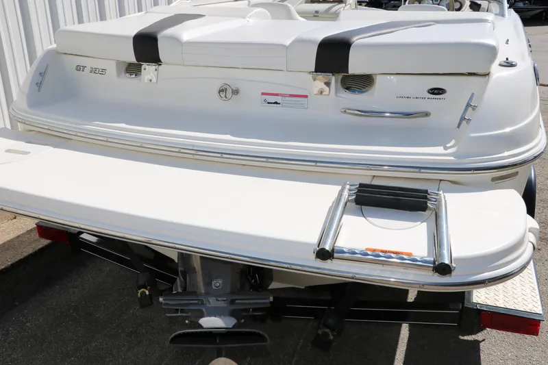 Slide: The Image of 2009 Glastron GT185 boat rear view with swim platform and ladder. - 32