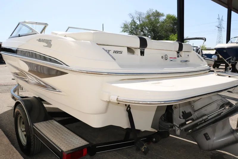 Slide: The Image of 2009 Glastron GT185 boat on trailer, rear view, white exterior. - 5