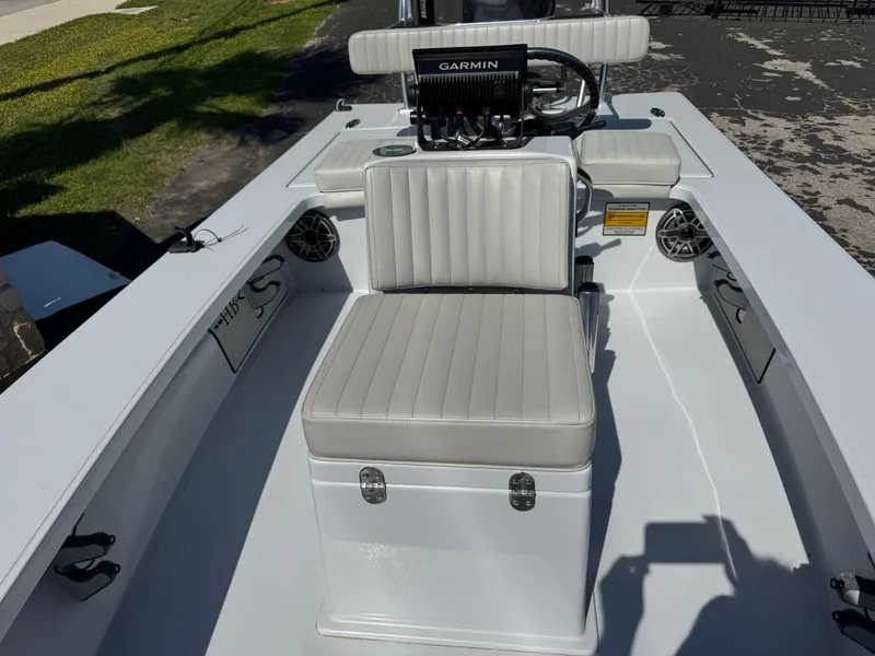 Slide: The Image of 2023 Hell's Bay Professional boat interior with Garmin system and cushioned seating. - 15