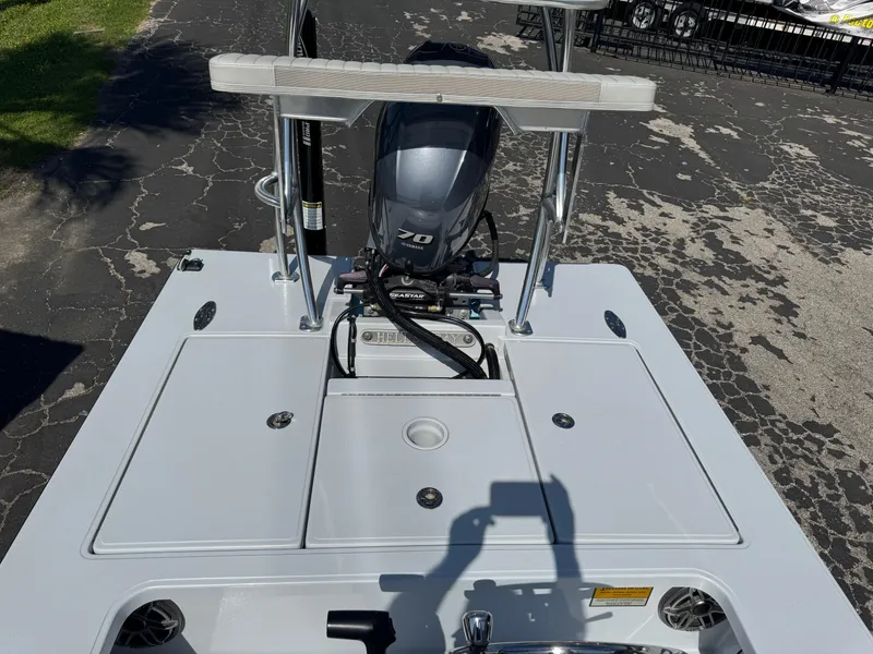 Slide: The Image of 2023 Hell's Bay Professional boat with outboard motor, viewed from the rear deck. - 20