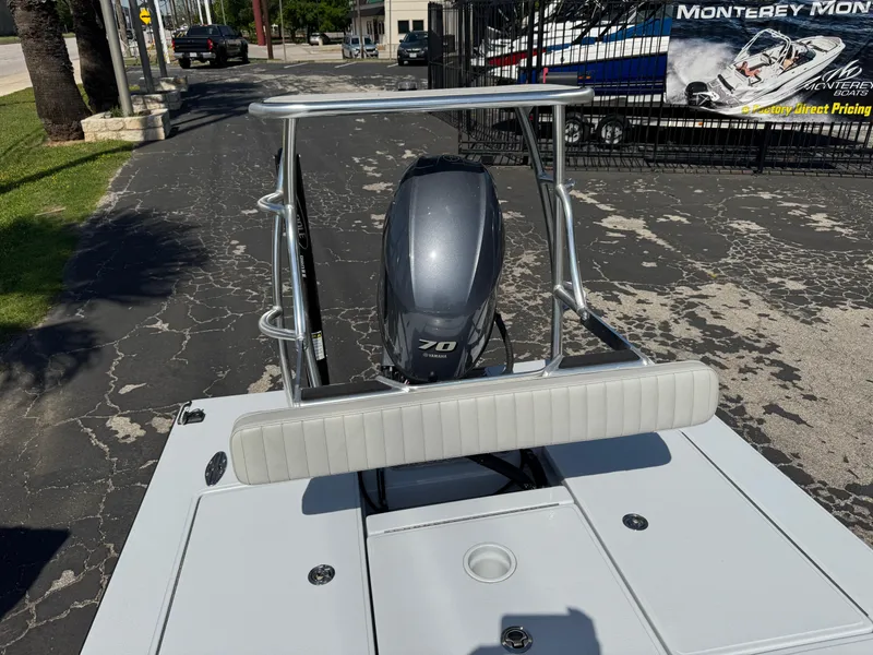 Slide: The Image of 2023 Hell's Bay Professional boat with a 70 HP engine, parked outdoors. - 26