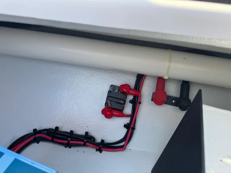 Slide: The Image of 2023 Hell's Bay Professional boat wiring and electrical components in storage compartment. - 34