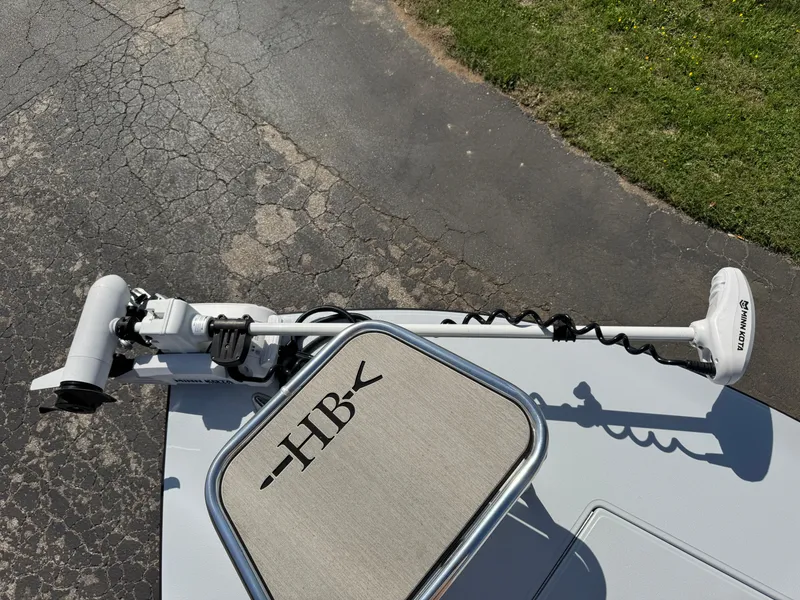 Slide: The Image of 2023 Hell's Bay Professional boat with trolling motor on pavement. - 36