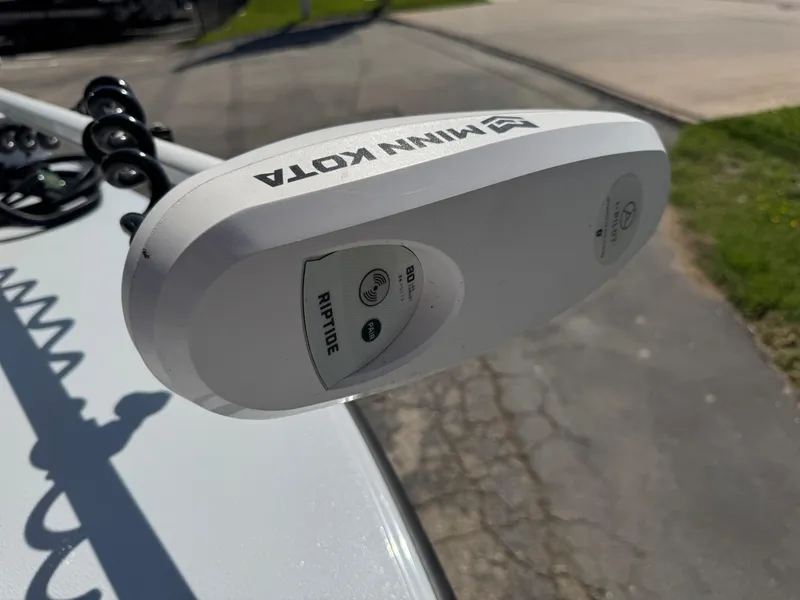 Slide: The Image of Minn Kota Riptide motor on 2023 Hell's Bay Professional boat, outdoor setting. - 37