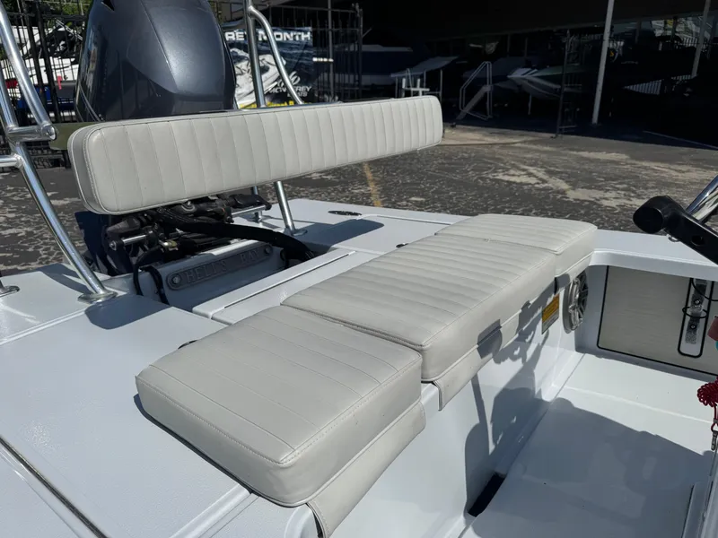 Slide: The Image of 2023 Hell's Bay Professional boat with cushioned seating and sleek design. - 9