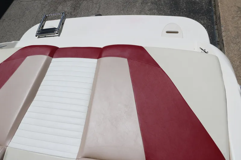 Slide: The Image of 2007 Glastron GT205 boat seat with red and white upholstery. - 28