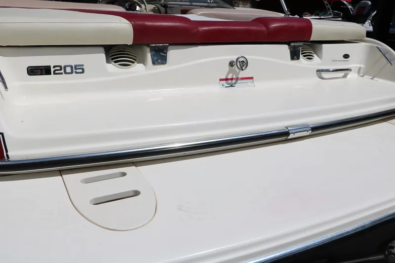 Slide: The Image of 2007 Glastron GT205 boat rear view with red and white seating. - 31