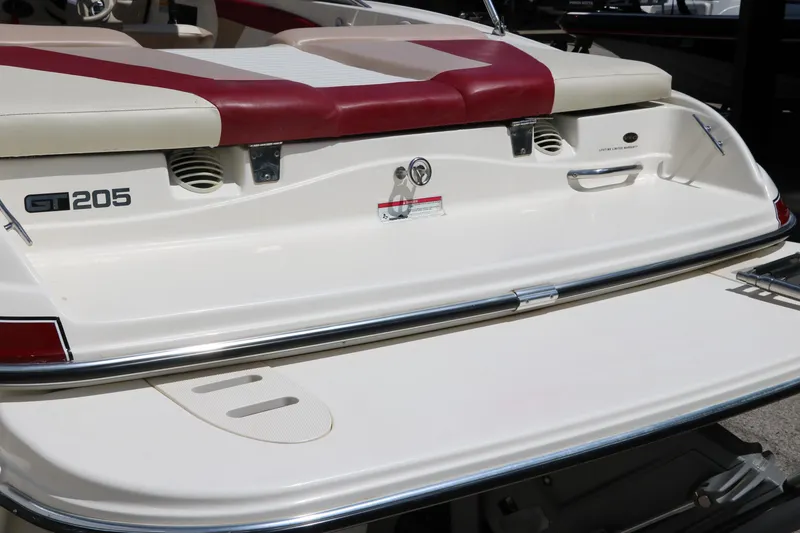 Slide: The Image of 2007 Glastron GT205 boat stern with red and white seating and swim platform. - 6