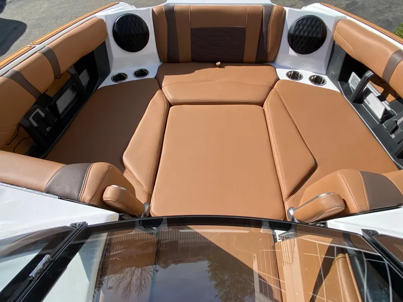 Slide: The Image of 2025 Malibu Wakesetter 22 MXZ interior with tan leather seating and modern design. - 11