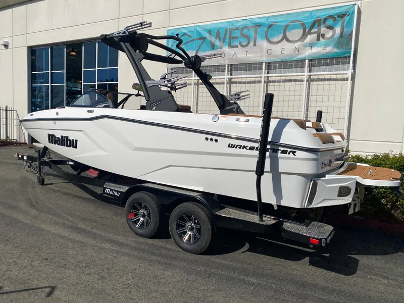 Slide: The Image of 2025 Malibu Wakesetter 22 MXZ boat on trailer at West Coast Boat Center. - 2
