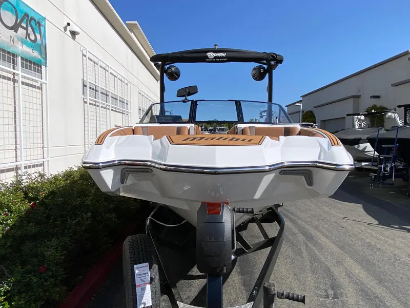 Slide: The Image of 2025 Malibu Wakesetter 22 MXZ boat on trailer, outdoor display. - 7