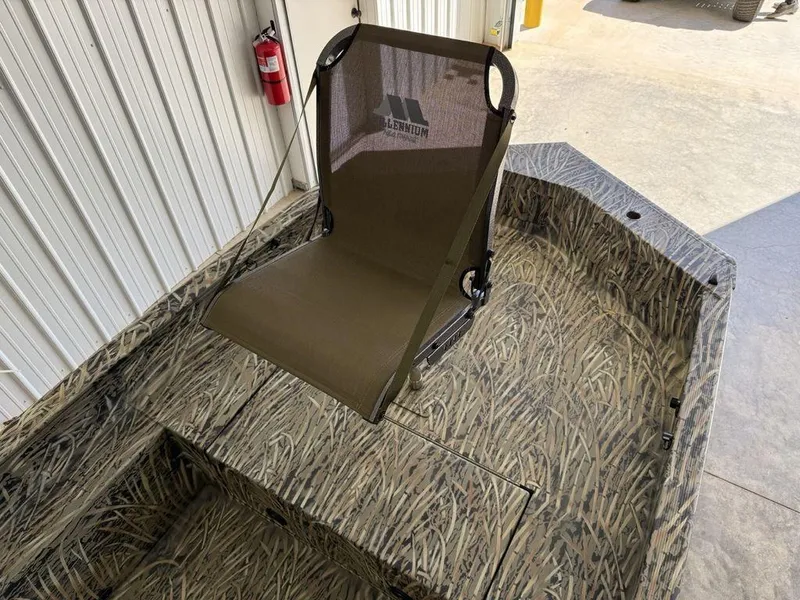 Slide: The Image of 2025 Tracker Grizzly® 1650 T Prairie Wings Edition boat with camo design and seating. - 4