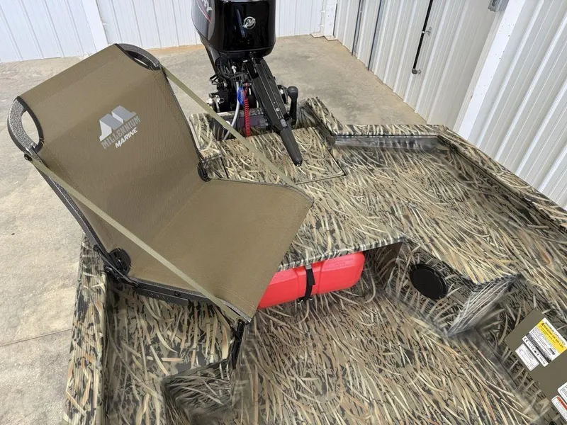 Slide: The Image of 2025 Tracker Grizzly® 1650 T Prairie Wings Edition boat with camo design and seating. - 6