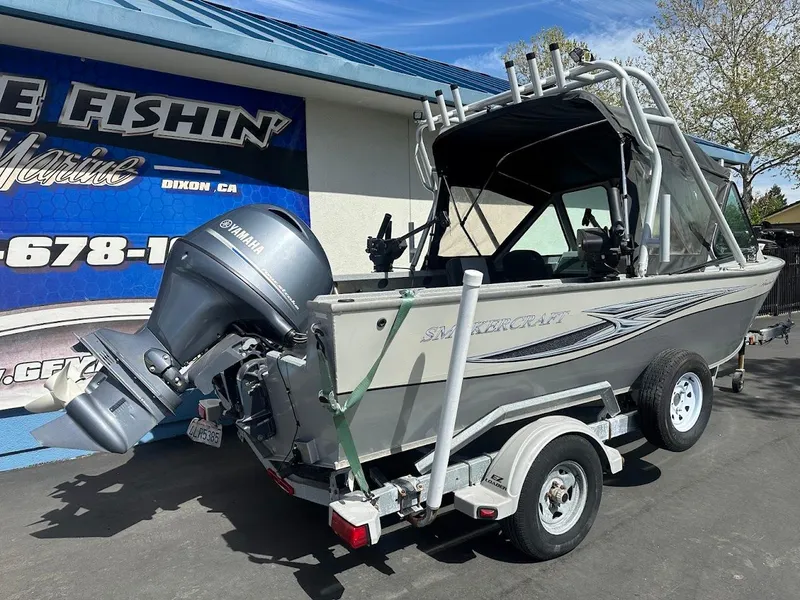 Slide: The Image of 2017 Smoker Craft 182 Phantom boat on trailer, parked outside a marine shop. - 10