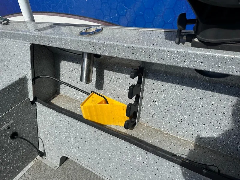 Slide: The Image of Interior view of a 2017 Smoker Craft 182 Phantom boat with storage compartment. - 17