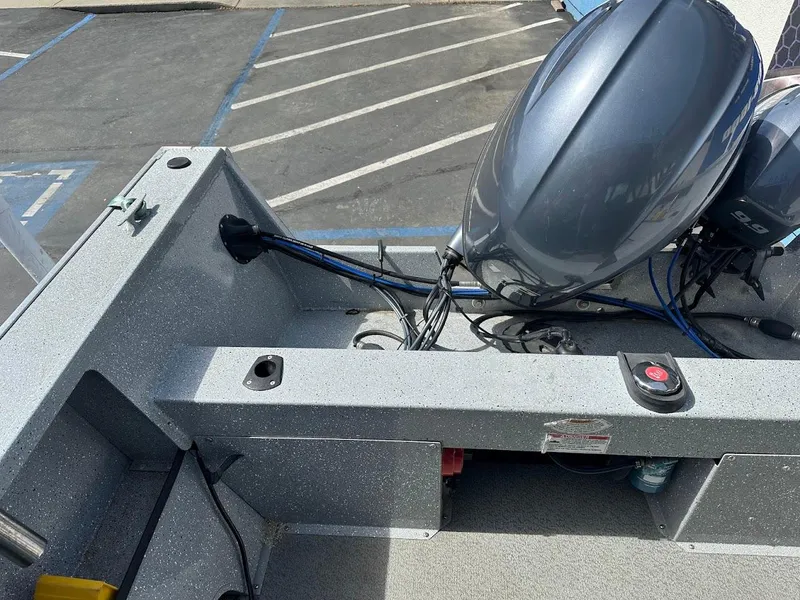 Slide: The Image of 2017 Smoker Craft 182 Phantom boat with motor in parking lot. - 19