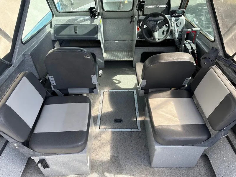 Slide: The Image of 2017 Smoker Craft 182 Phantom boat interior with seating and steering console. - 21