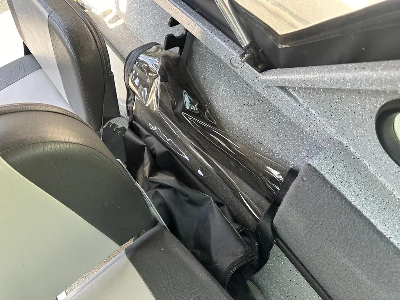 Slide: The Image of Interior view of a 2017 Smoker Craft 182 Phantom boat, featuring seating and storage area. - 25